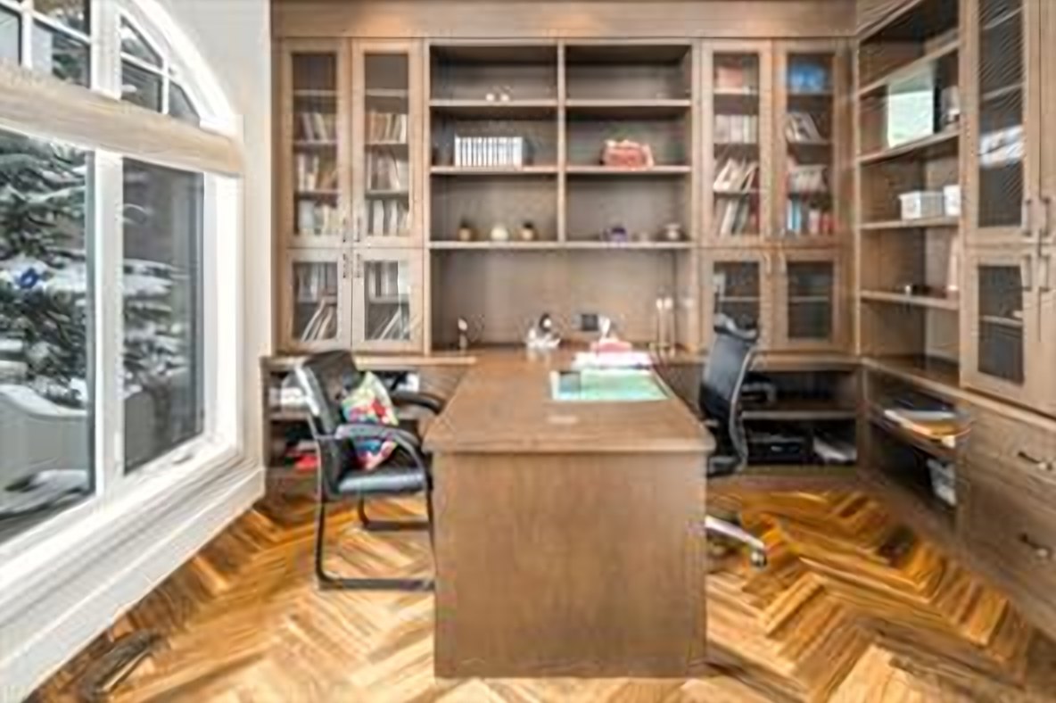 Main-floor office with custom built-in desk and shelving